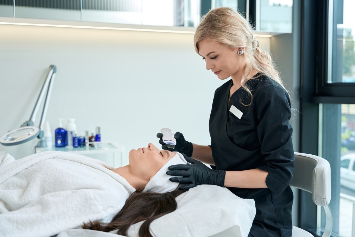 Dermatologist in Bloomington examining a changing mole for skin cancer signs